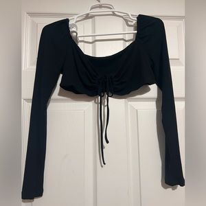 Black long sleeve top. Ties in the front!